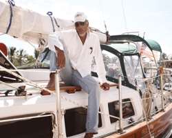 He also has a boat to sail in the Caribbean. He went sailing in his boat once a year.